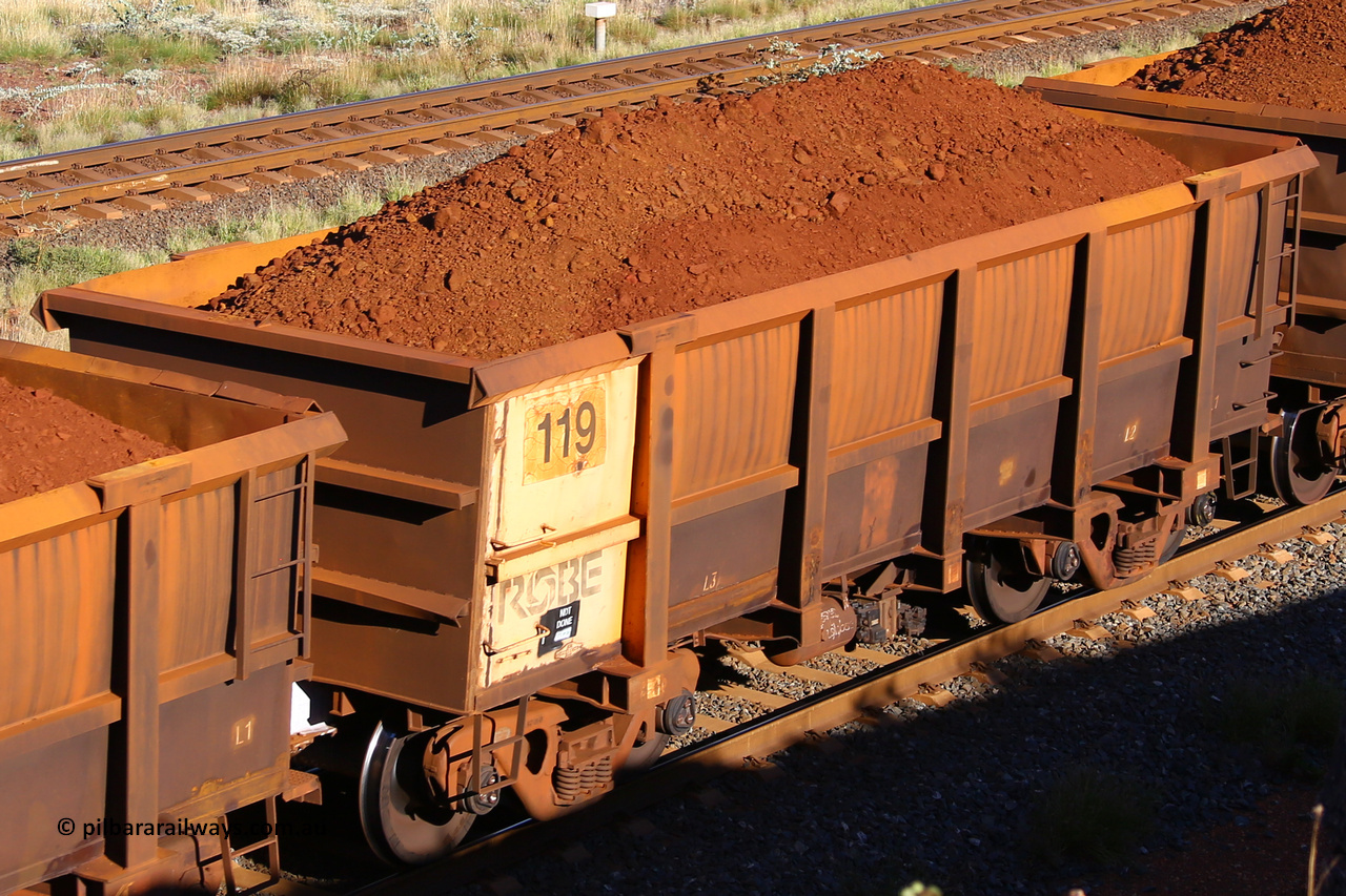 0119 210322 9784
Robe River ore waggon 119, built by Nippon Sharyo Nihon, rotary coupler end non-handbrake side loaded view at the 17 km on the Cape Lambert line, March 22, 2021.
Keywords: 119;Nippon-Sharyo-Nihon;Robe-ore-waggon;