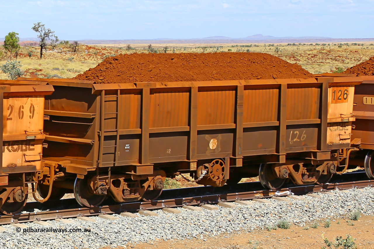 0126 170729 0221
Robe River ore waggon 126, built by Nippon Sharyo Nihon, fixed coupler handbrake side loaded view at the 103 km, between Maitland Siding and the Fortescue River on the Deepdale line. July 29, 2017.
Keywords: 126;Nippon-Sharyo-Nihon;Robe-ore-waggon;