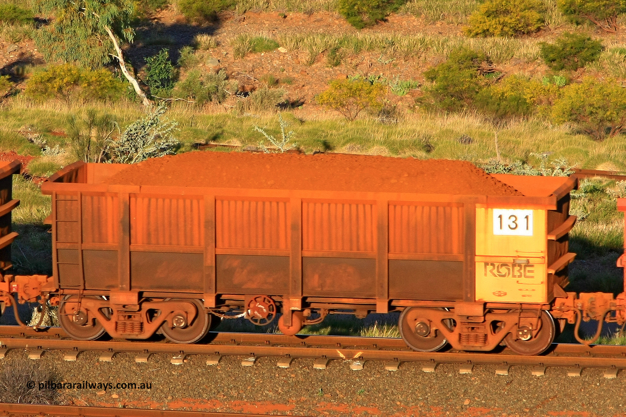 0131 110602 1661
Robe River ore waggon 131, built by Nippon Sharyo Nihon, rotary coupler end handbrake side loaded view at the 71 km, Western Creek on the Deepdale line. June 2, 2011.
Keywords: 131;Nippon-Sharyo-Nihon;Robe-ore-waggon;