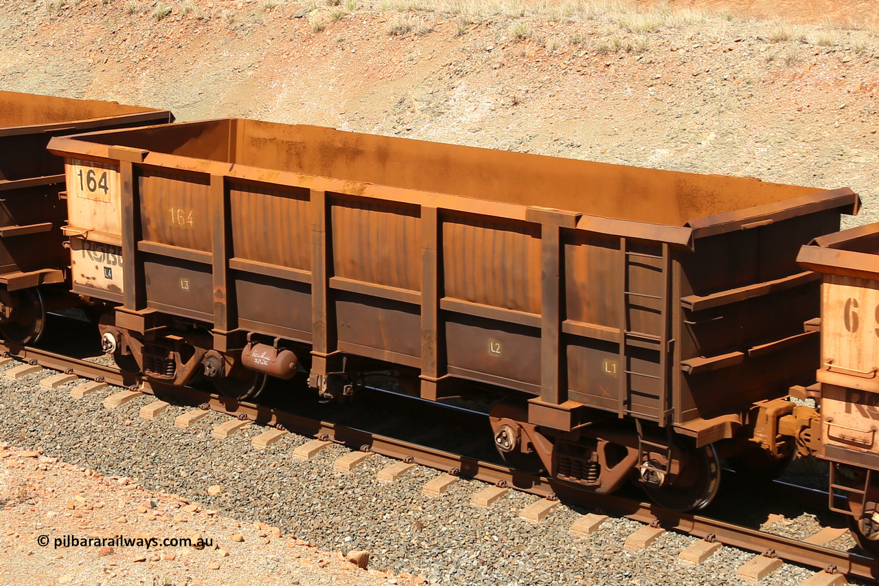 0164 160306 1279
Robe River ore waggon 164, built by Nippon Sharyo Nihon, fixed coupler non-handbrake side empty view at Greenpool on the Cape Lambert line. March 6, 2016.
Keywords: 164;Nippon-Sharyo-Nihon;Robe-ore-waggon;