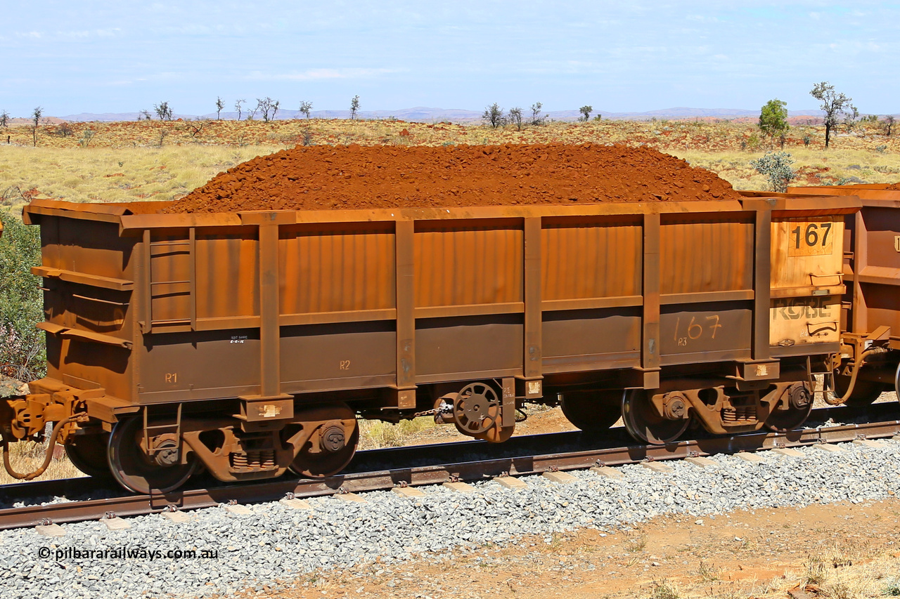 0167 170729 0214
Robe River ore waggon 167, built by Nippon Sharyo Nihon, fixed coupler handbrake side loaded view at the 103 km, between Maitland Siding and the Fortescue River on the Deepdale line. July 29, 2017.
Keywords: 167;Nippon-Sharyo-Nihon;Robe-ore-waggon;