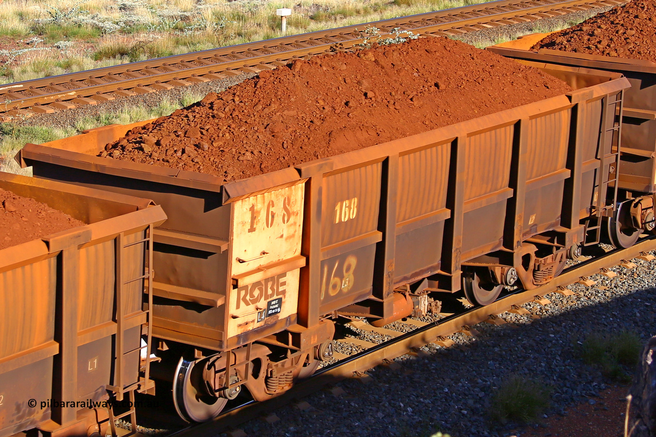 0168 210322 9781
Robe River ore waggon 168, built by Nippon Sharyo Nihon, rotary coupler end non-handbrake side loaded view at the 17 km on the Cape Lambert line, March 22, 2021.
Keywords: 168;Nippon-Sharyo-Nihon;Robe-ore-waggon;