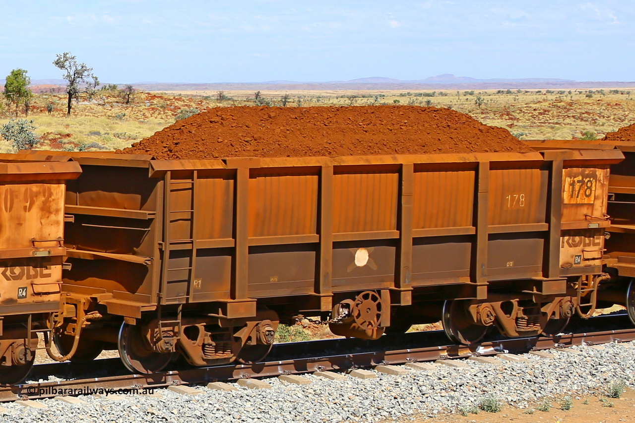 0178 170729 0218
Robe River ore waggon 178, built by Nippon Sharyo Nihon, fixed coupler handbrake side loaded view at the 103 km, between Maitland Siding and the Fortescue River on the Deepdale line. July 29, 2017.
Keywords: 178;Nippon-Sharyo-Nihon;Robe-ore-waggon;