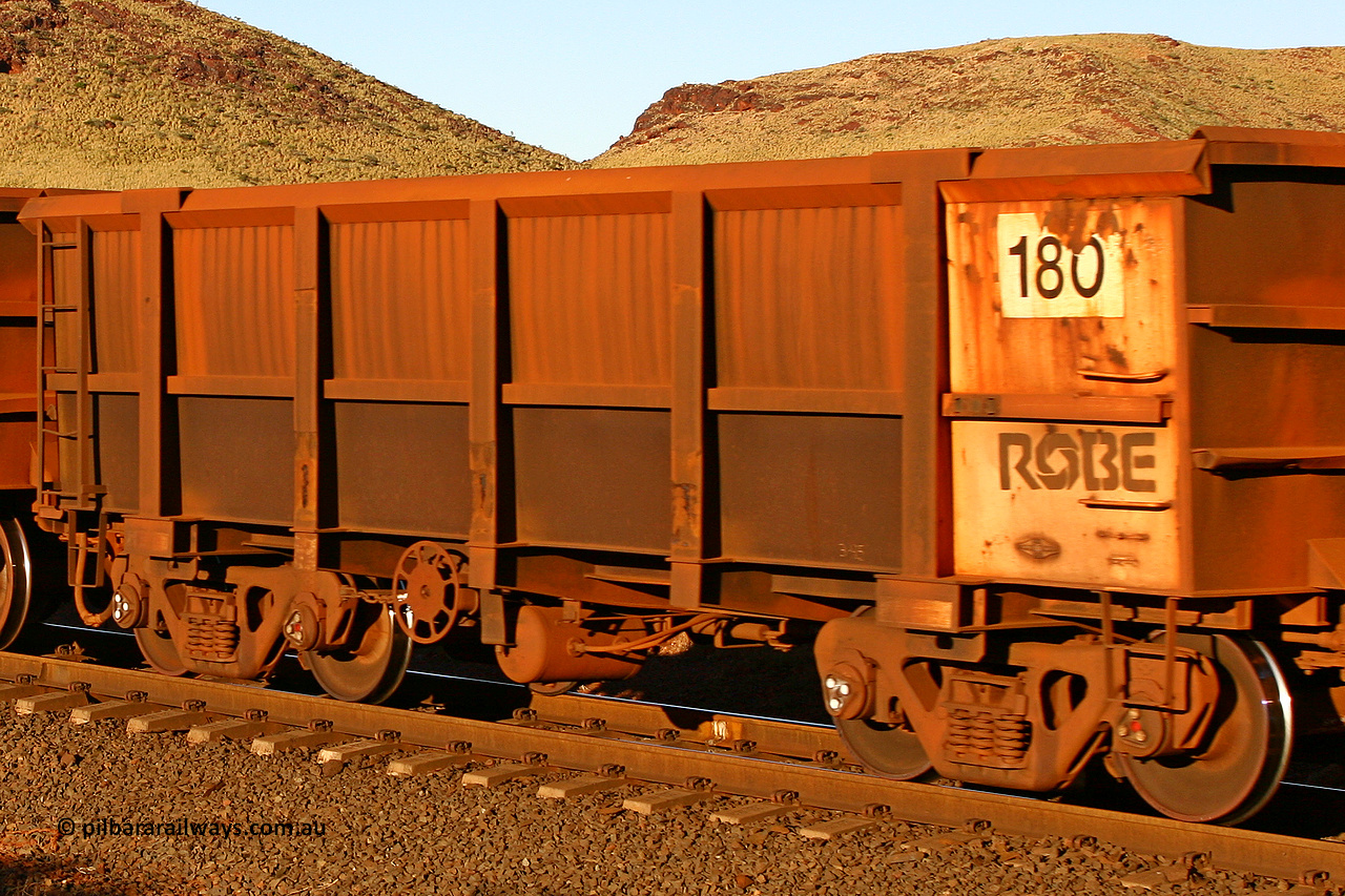 0180 060722 7605
Robe River ore waggon 180, built by Nippon Sharyo Nihon, rotary coupler end handbrake side empty view, at the 11.7 km, Cape Lambert. July 22, 2006.
Keywords: 180;Nippon-Sharyo-Nihon;Robe-ore-waggon;