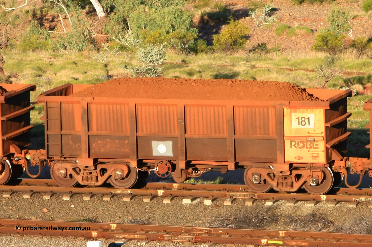 0181 110602 1602
Robe River ore waggon 181, built by Nippon Sharyo Nihon, rotary coupler end handbrake side loaded view at the 71 km, Western Creek on the Deepdale line. June 2, 2011.
Keywords: 181;Nippon-Sharyo-Nihon;Robe-ore-waggon;