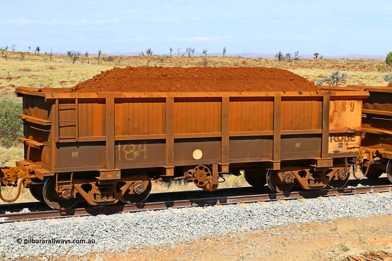 0189 170729 0237
Robe River ore waggon 189, built by Nippon Sharyo Nihon, fixed coupler handbrake side loaded view at the 103 km, between Maitland Siding and the Fortescue River on the Deepdale line. July 29, 2017.
Keywords: 189;Nippon-Sharyo-Nihon;Robe-ore-waggon;