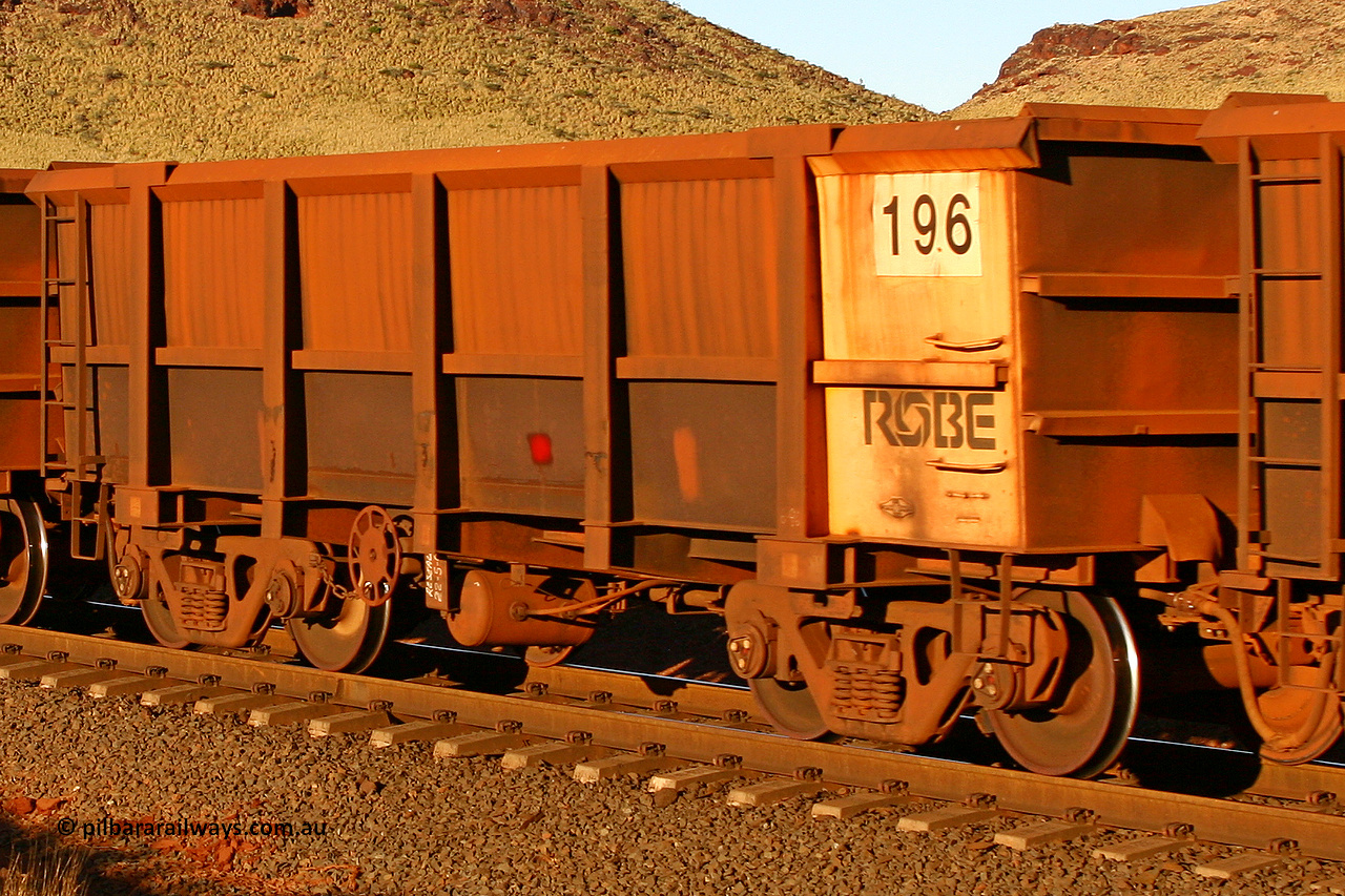 0196 060722 7631
Robe River ore waggon 196, built by Nippon Sharyo Nihon, rotary coupler end handbrake side empty view, at the 11.7 km, Cape Lambert. July 22, 2006.
Keywords: 196;Nippon-Sharyo-Nihon;Robe-ore-waggon;