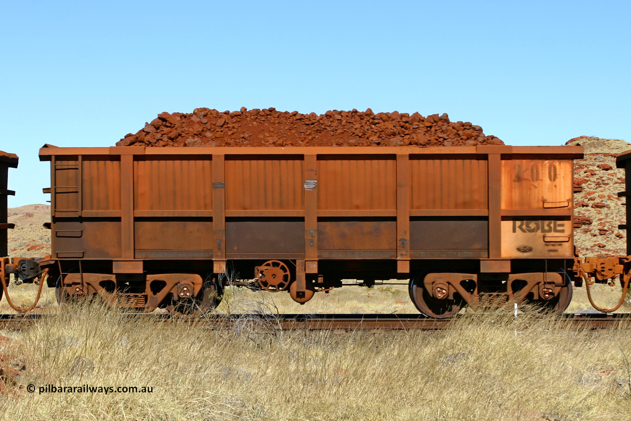 0200 060722 7525
Robe River ore waggon 200, built by Nippon Sharyo Nihon, handbrake side loaded view at the 78.8 km between Western Creek and Maitland on the Deepdale line. July 22, 2006.
Keywords: 200;Nippon-Sharyo-Nihon;Robe-ore-waggon;