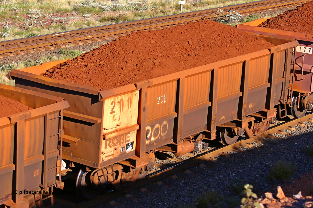 0200 210322 9760
Robe River ore waggon 200, built by Nippon Sharyo Nihon, rotary coupler end non-handbrake side loaded view at the 17 km on the Cape Lambert line, March 22, 2021.
Keywords: 200;Nippon-Sharyo-Nihon;Robe-ore-waggon;