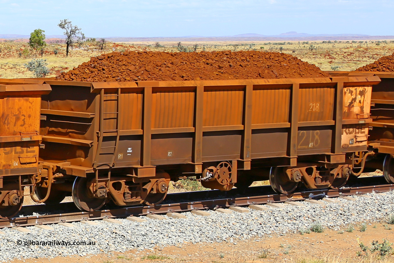0218 170729 0205
Robe River ore waggon 218, built by Nippon Sharyo Nihon, fixed coupler handbrake side loaded view at the 103 km, between Maitland Siding and the Fortescue River on the Deepdale line. July 29, 2017.
Keywords: 218;Nippon-Sharyo-Nihon;Robe-ore-waggon;