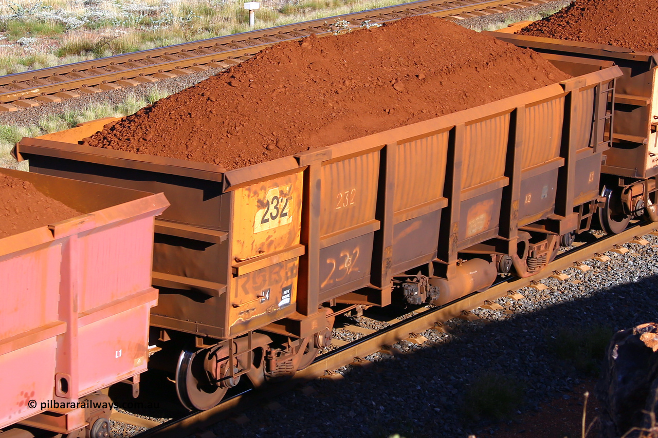 0232 210322 9701
Robe River ore waggon 232, built by Nippon Sharyo Nihon, rotary coupler end non-handbrake side loaded view at the 17 km on the Cape Lambert line, March 22, 2021.
Keywords: 232;Nippon-Sharyo-Nihon;Robe-ore-waggon;