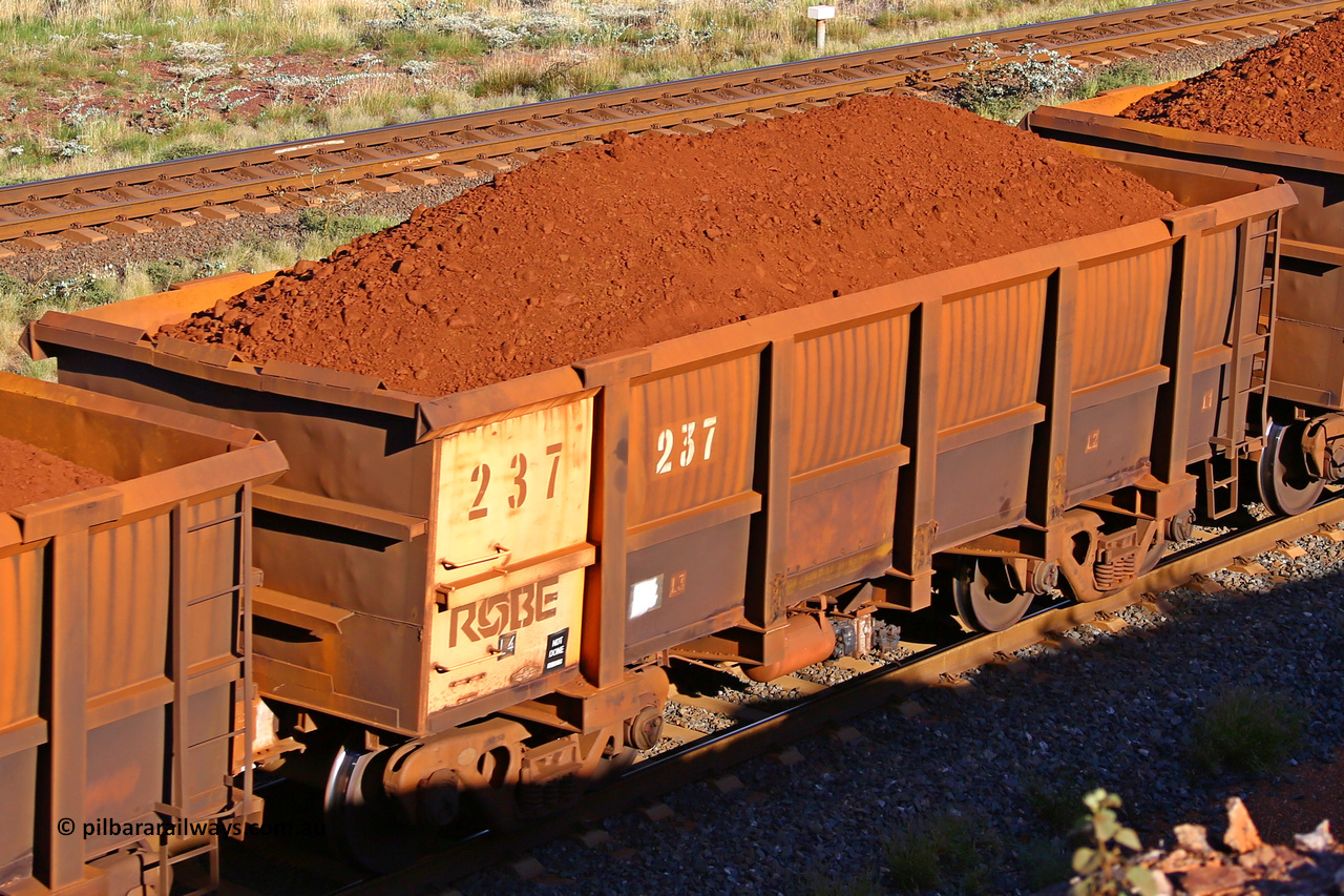 0237 210322 9759
Robe River ore waggon 237, built by Nippon Sharyo Nihon, rotary coupler end non-handbrake side loaded view at the 17 km on the Cape Lambert line, March 22, 2021.
Keywords: 237;Nippon-Sharyo-Nihon;Robe-ore-waggon;