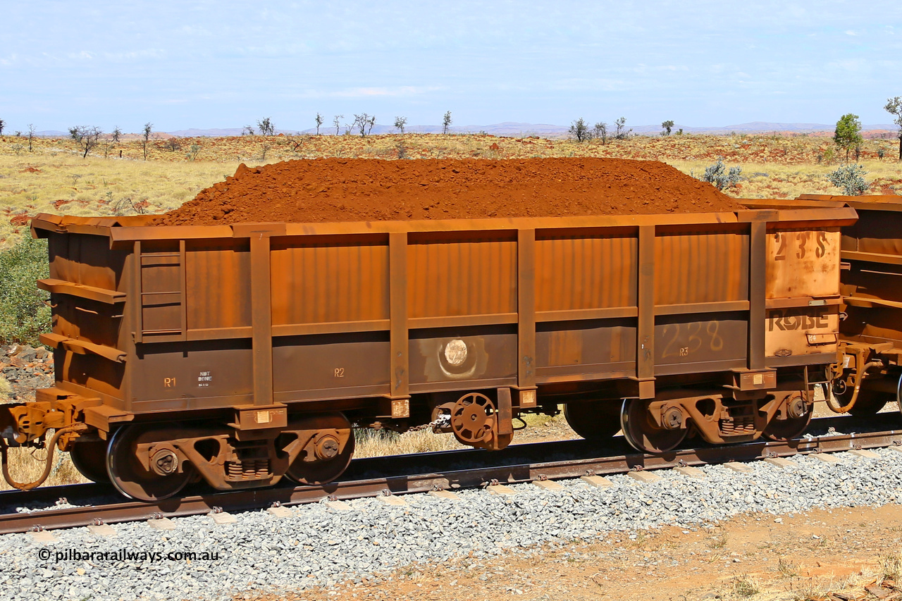 0238 170729 0252
Robe River ore waggon 238, built by Nippon Sharyo Nihon, fixed coupler handbrake side loaded view at the 103 km, between Maitland Siding and the Fortescue River on the Deepdale line. July 29, 2017.
Keywords: 238;Nippon-Sharyo-Nihon;Robe-ore-waggon;