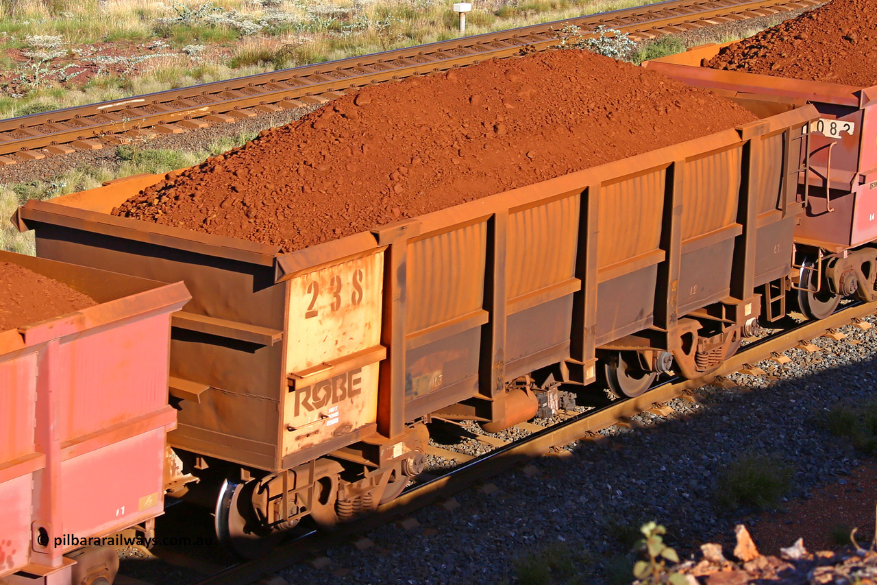 0238 210322 9726
Robe River ore waggon 238, built by Nippon Sharyo Nihon, rotary coupler end non-handbrake side loaded view at the 17 km on the Cape Lambert line, March 22, 2021.
Keywords: 238;Nippon-Sharyo-Nihon;Robe-ore-waggon;