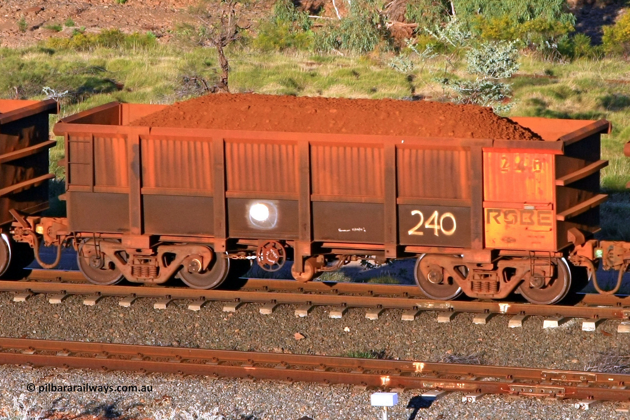 0240 110602 1640
Robe River ore waggon 240, built by Nippon Sharyo Nihon, rotary coupler end handbrake side loaded view at the 71 km, Western Creek on the Deepdale line. June 2, 2011.
Keywords: 240;Nippon-Sharyo-Nihon;Robe-ore-waggon;