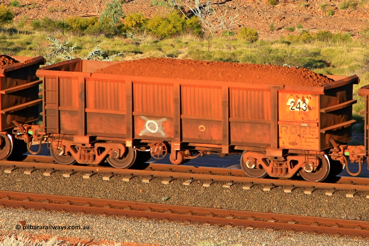 0243 110602 1724
Robe River ore waggon 243, built by Nippon Sharyo Nihon, rotary coupler end handbrake side loaded view at the 71 km, Western Creek on the Deepdale line. June 2, 2011.
Keywords: 243;Nippon-Sharyo-Nihon;Robe-ore-waggon;