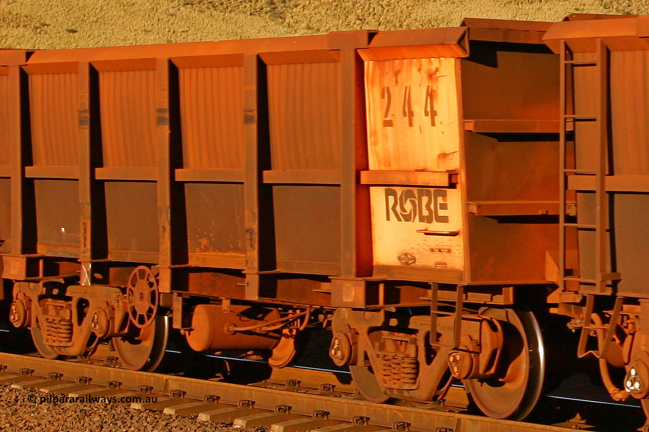 0244 060722 7620
Robe River ore waggon 244, built by Nippon Sharyo Nihon, rotary coupler end handbrake side empty view, at the 11.7 km, Cape Lambert. July 22, 2006.
Keywords: 244;Nippon-Sharyo-Nihon;Robe-ore-waggon;