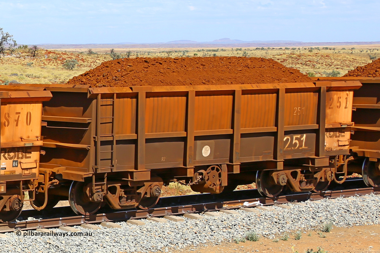0251 170729 0220
Robe River ore waggon 251, built by Nippon Sharyo Nihon, fixed coupler handbrake side loaded view at the 103 km, between Maitland Siding and the Fortescue River on the Deepdale line. July 29, 2017.
Keywords: 251;Nippon-Sharyo-Nihon;Robe-ore-waggon;