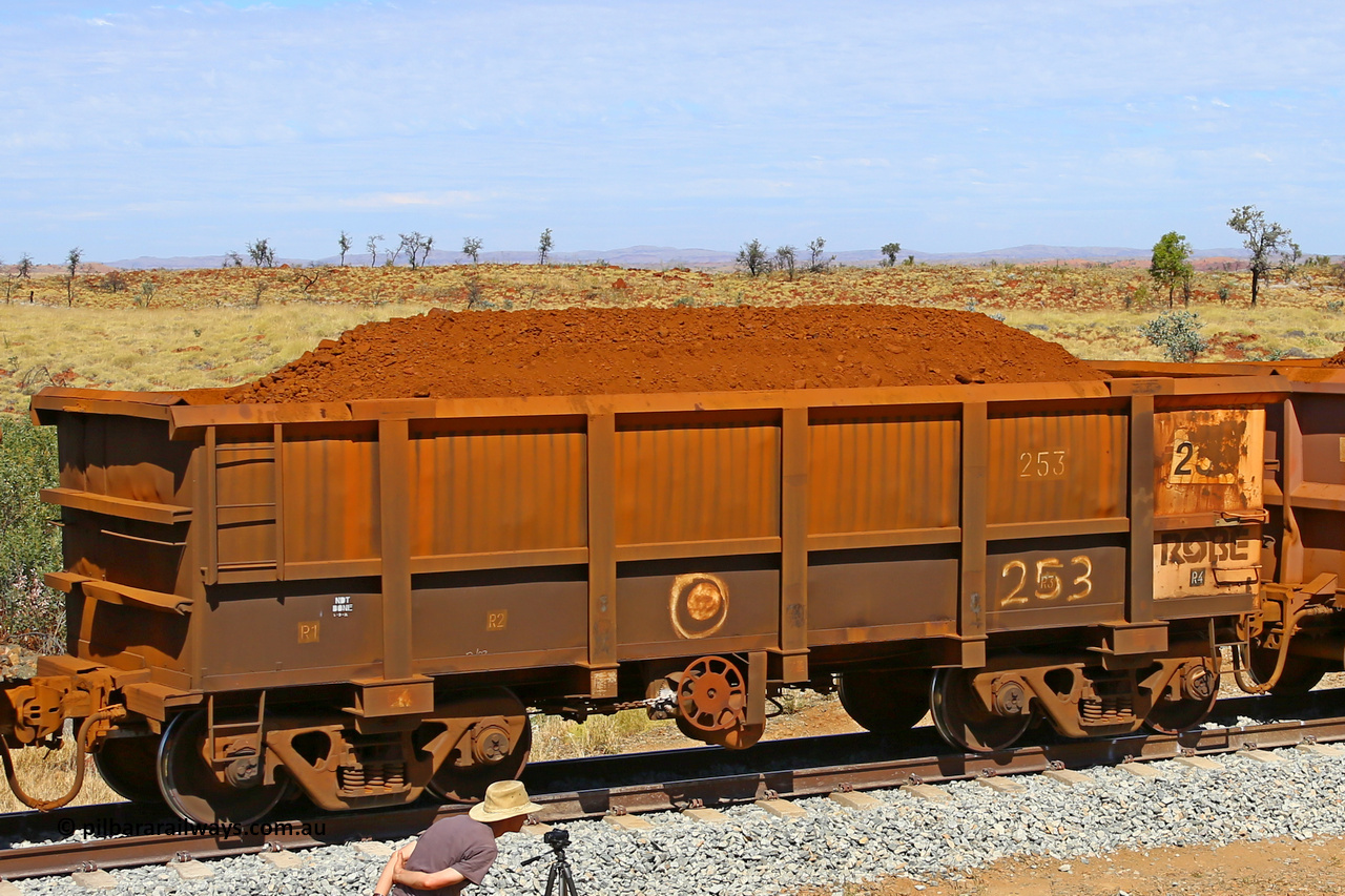 0253 170729 0267
Robe River ore waggon 253, built by Nippon Sharyo Nihon, fixed coupler handbrake side loaded view at the 103 km, between Maitland Siding and the Fortescue River on the Deepdale line. July 29, 2017.
Keywords: 253;Nippon-Sharyo-Nihon;Robe-ore-waggon;