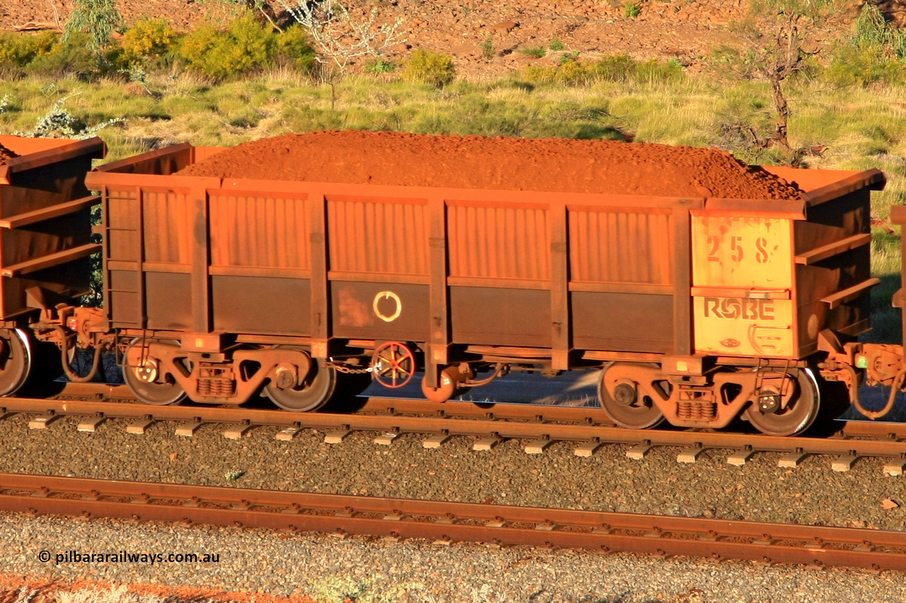 0258 110602 1645
Robe River ore waggon 258, built by Nippon Sharyo Nihon, rotary coupler end handbrake side loaded view at the 71 km, Western Creek on the Deepdale line. June 2, 2011.
Keywords: 258;Nippon-Sharyo-Nihon;Robe-ore-waggon;