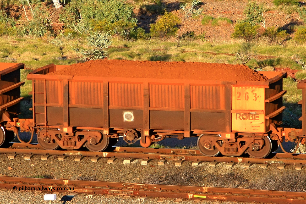 0263 110602 1670
Robe River ore waggon 263, built by Nippon Sharyo Nihon, rotary coupler end handbrake side loaded view at the 71 km, Western Creek on the Deepdale line. June 2, 2011.
Keywords: 263;Nippon-Sharyo-Nihon;Robe-ore-waggon;