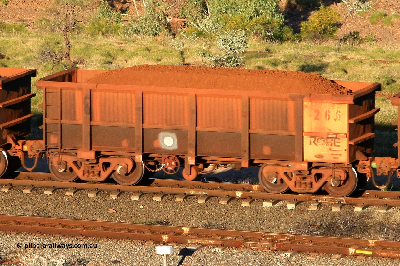 0266 110602 1614
Robe River ore waggon 266, built by Nippon Sharyo Nihon, rotary coupler end handbrake side loaded view at the 71 km, Western Creek on the Deepdale line. June 2, 2011.
Keywords: 266;Nippon-Sharyo-Nihon;Robe-ore-waggon;