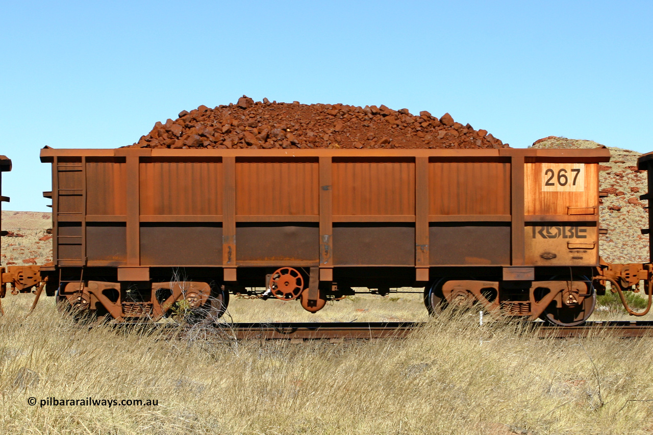 0267 060722 7510
Robe River ore waggon 267, built by Nippon Sharyo Nihon, handbrake side loaded view at the 78.8 km between Western Creek and Maitland on the Deepdale line. July 22, 2006.
Keywords: 267;Nippon-Sharyo-Nihon;Robe-ore-waggon;
