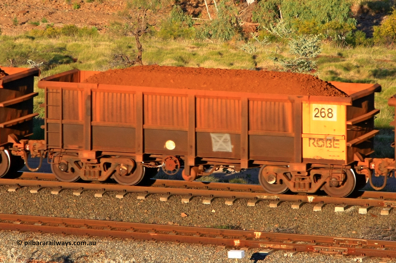 0268 110602 1620
Robe River ore waggon 268, built by Nippon Sharyo Nihon, rotary coupler end handbrake side loaded view at the 71 km, Western Creek on the Deepdale line. June 2, 2011.
Keywords: 268;Nippon-Sharyo-Nihon;Robe-ore-waggon;