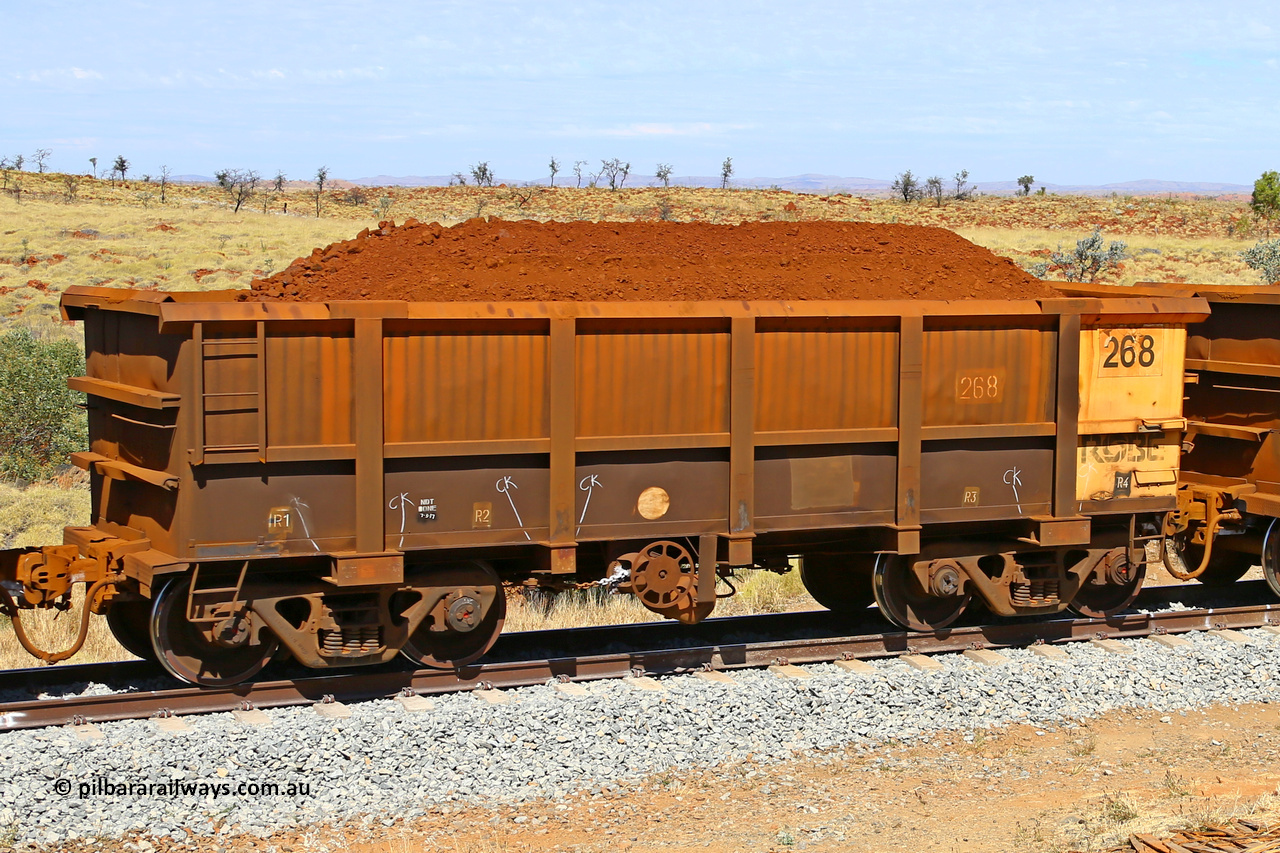 0268 170729 0235
Robe River ore waggon 268, built by Nippon Sharyo Nihon, fixed coupler handbrake side loaded view at the 103 km, between Maitland Siding and the Fortescue River on the Deepdale line. July 29, 2017.
Keywords: 268;Nippon-Sharyo-Nihon;Robe-ore-waggon;