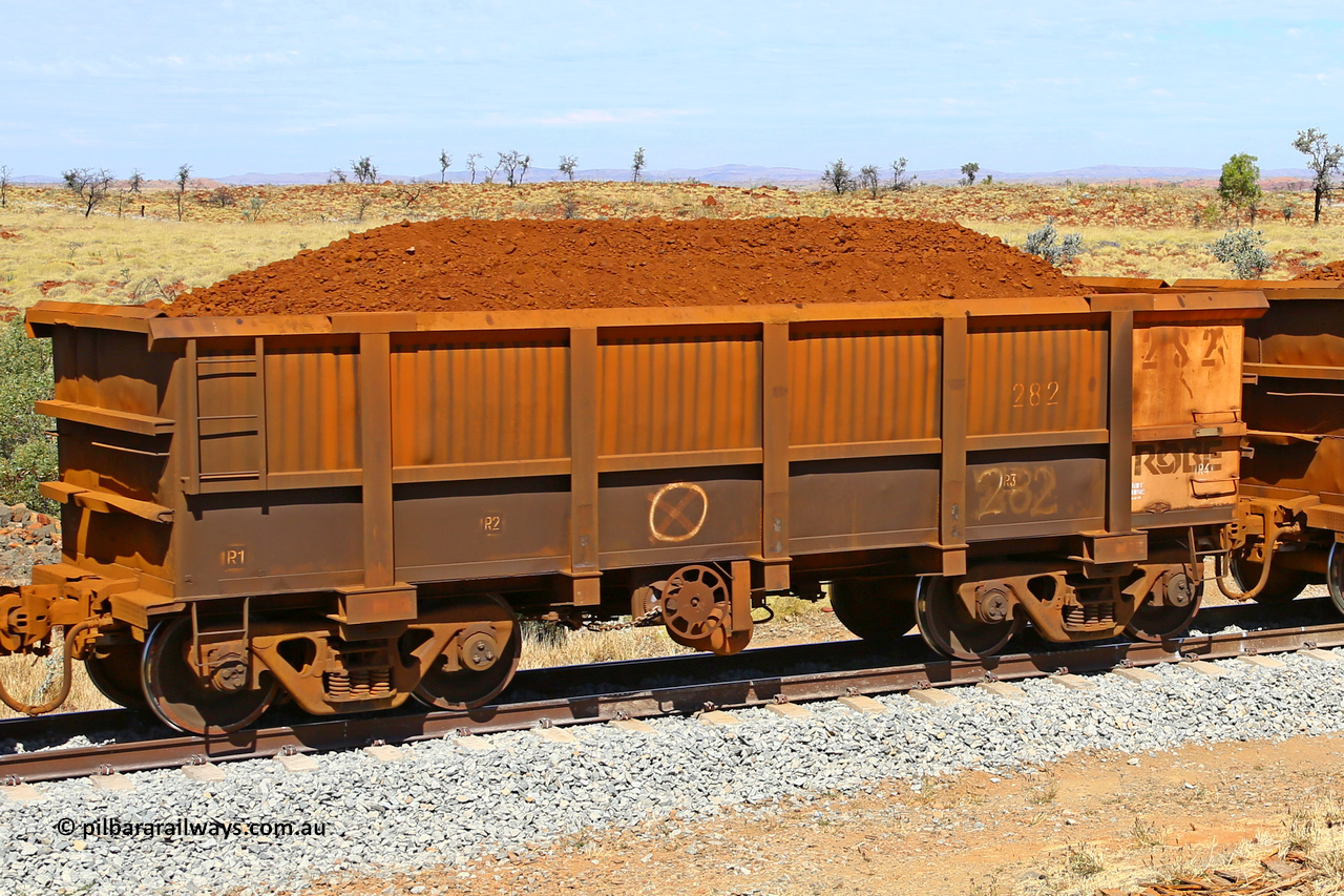 0282 170729 0216
Robe River ore waggon 282, built by Nippon Sharyo Nihon, fixed coupler handbrake side loaded view at the 103 km, between Maitland Siding and the Fortescue River on the Deepdale line. July 29, 2017.
Keywords: 282;Nippon-Sharyo-Nihon;Robe-ore-waggon;