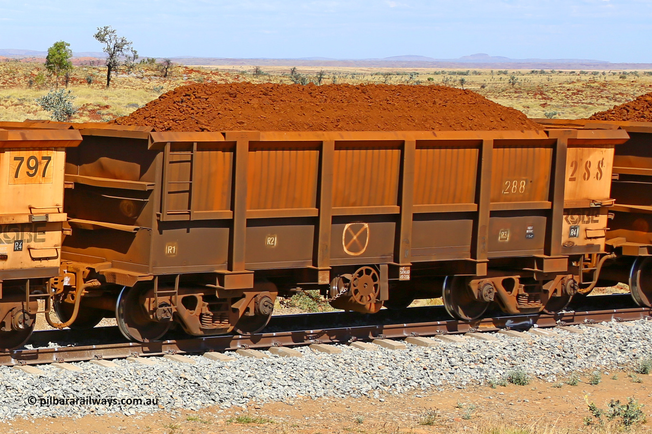 0288 170729 0242
Robe River ore waggon 288, built by Nippon Sharyo Nihon, fixed coupler handbrake side loaded view at the 103 km, between Maitland Siding and the Fortescue River on the Deepdale line. July 29, 2017.
Keywords: 288;Nippon-Sharyo-Nihon;Robe-ore-waggon;