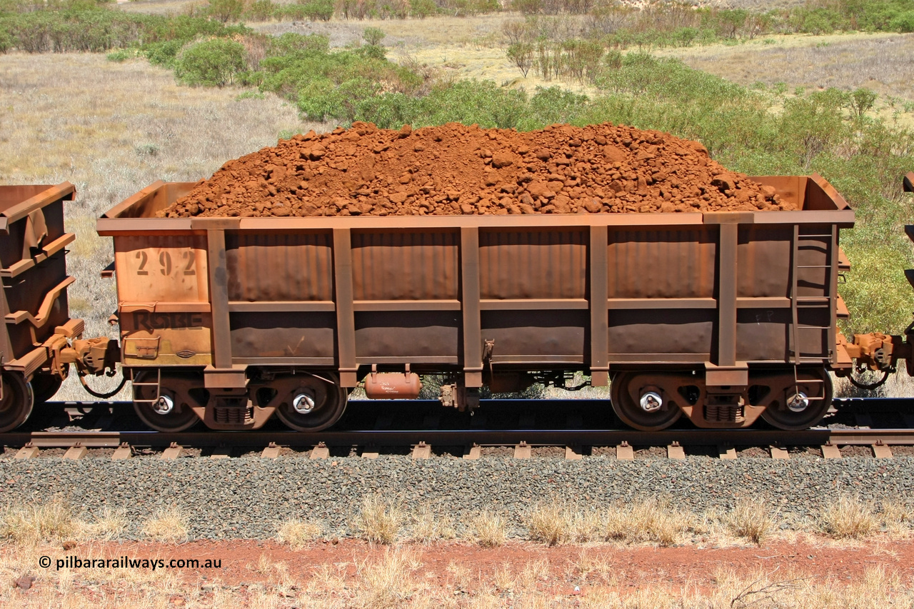 0292 081209 0146
Robe River ore waggon 292, built by Nippon Sharyo Nihon, non-handbrake side loaded view at the 7 km location just south of Cape Lambert yard. December 9, 2008.
Keywords: 292;Nippon-Sharyo-Nihon;Robe-ore-waggon;