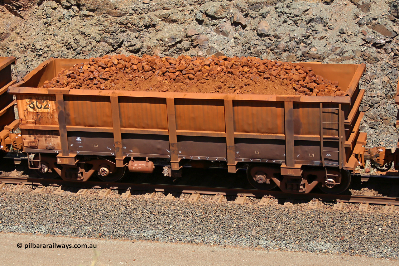0302 160306 1668
Robe River ore waggon 302, built by Nippon Sharyo Nihon, fixed coupler non-handbrake side loaded view at the 45 km, Harding Siding on the Cape Lambert line. March 6, 2016.
Keywords: 302;Nippon-Sharyo-Nihon;Robe-ore-waggon;