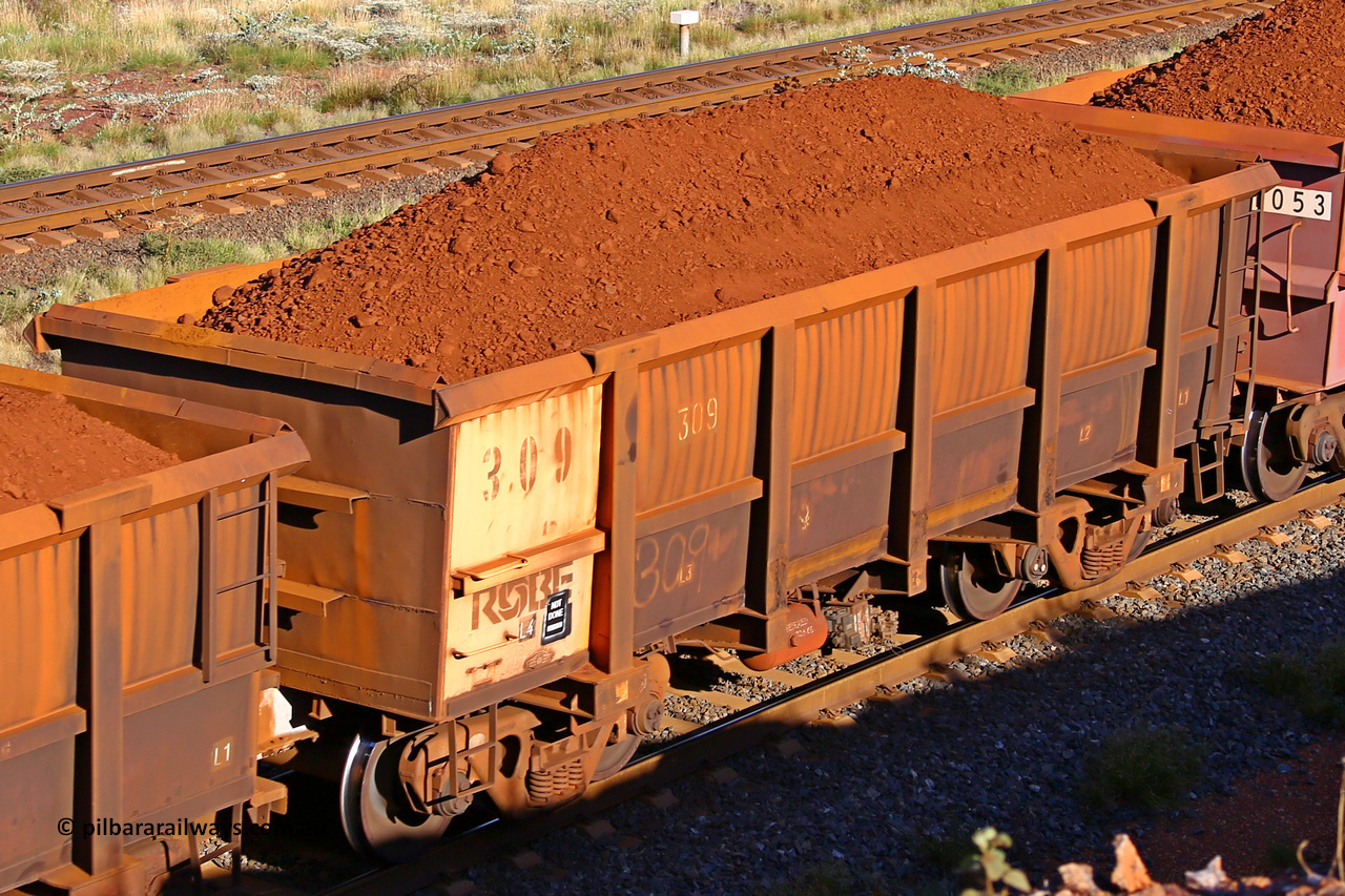 0309 210322 9718
Robe River ore waggon 309, built by Nippon Sharyo Nihon, rotary coupler end non-handbrake side loaded view at the 17 km on the Cape Lambert line, March 22, 2021.
Keywords: 309;Nippon-Sharyo-Nihon;Robe-ore-waggon;