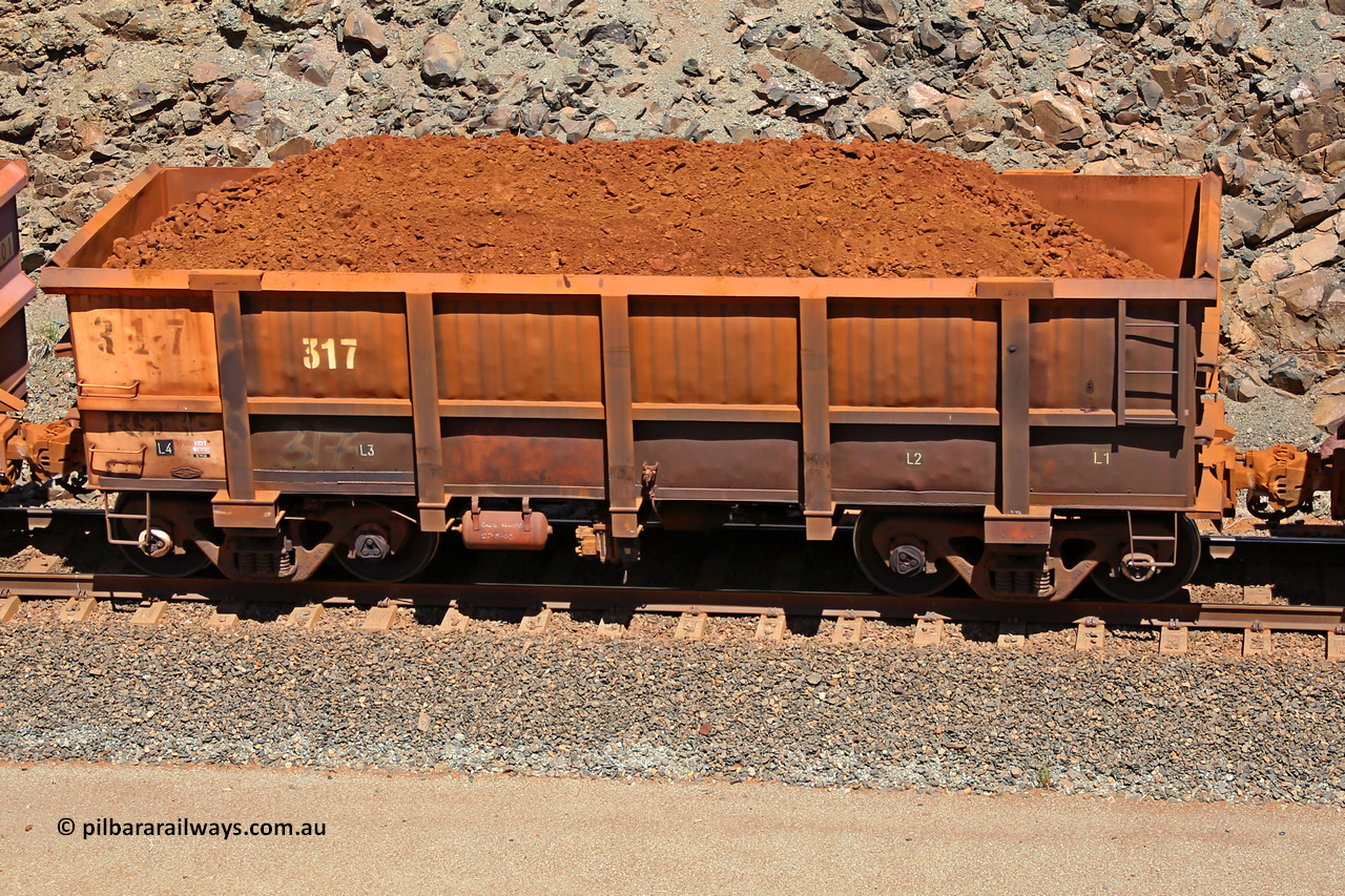 0317 160306 1533
Robe River ore waggon 317, built by Nippon Sharyo Nihon, fixed coupler non-handbrake side loaded view at the 45 km, Harding Siding on the Cape Lambert line. March 6, 2016.
Keywords: 317;Nippon-Sharyo-Nihon;Robe-ore-waggon;