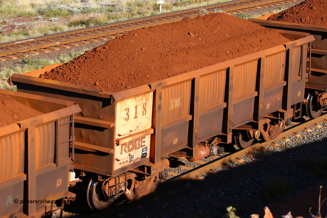 0318 210322 9702
Robe River ore waggon 318, built by Nippon Sharyo Nihon, rotary coupler end non-handbrake side loaded view at the 17 km on the Cape Lambert line, March 22, 2021.
Keywords: 318;Nippon-Sharyo-Nihon;Robe-ore-waggon;