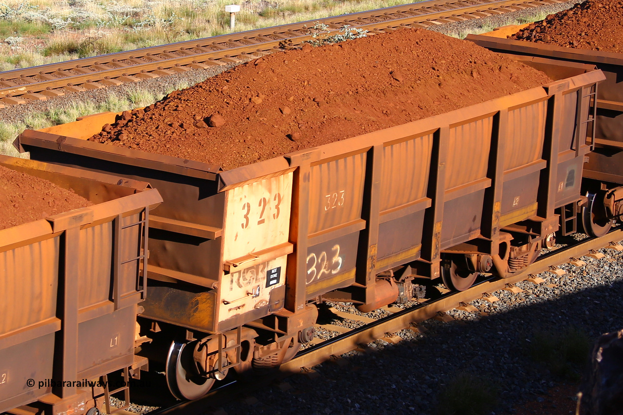 0323 210322 9787
Robe River ore waggon 323, built by Nippon Sharyo Nihon, rotary coupler end non-handbrake side loaded view at the 17 km on the Cape Lambert line, March 22, 2021.
Keywords: 323;Nippon-Sharyo-Nihon;Robe-ore-waggon;