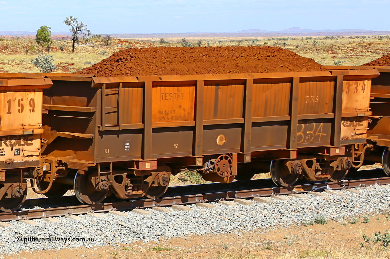 0334 170729 0228
Robe River ore waggon 334, built by Nippon Sharyo Nihon, fixed coupler handbrake side loaded view. Stencil says TEST 3 DO NOT UNCOUPLE, at the 103 km, between Maitland Siding and the Fortescue River on the Deepdale line. July 29, 2017.
Keywords: 334;Nippon-Sharyo-Nihon;Robe-ore-waggon;