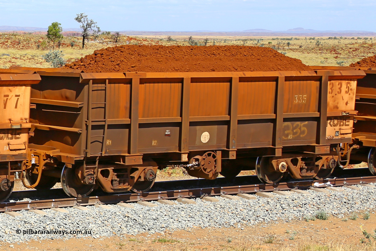 0335 170729 0245
Robe River ore waggon 335, built by Nippon Sharyo Nihon, fixed coupler handbrake side loaded view at the 103 km, between Maitland Siding and the Fortescue River on the Deepdale line. July 29, 2017.
Keywords: 335;Nippon-Sharyo-Nihon;Robe-ore-waggon;