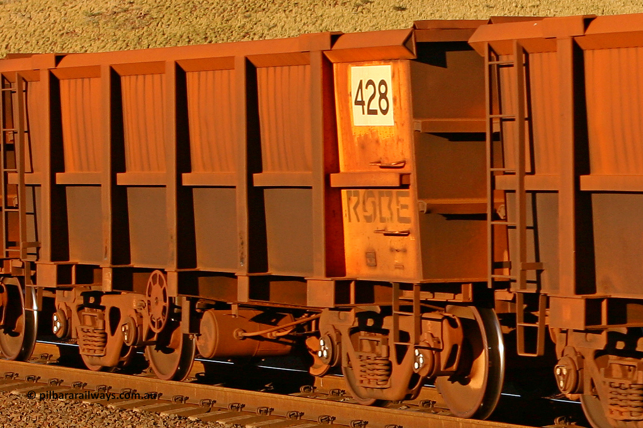 0428 060722 7589
Robe River ore waggon 428, built by Tomlinson Steel WA, rotary coupler end handbrake side empty view, at the 11.7 km, Cape Lambert. July 22, 2006.
Keywords: 428;Tomlinson-Steel-WA;Robe-ore-waggon;