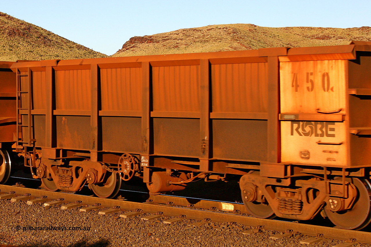 0450 060722 7618
Robe River ore waggon 450, built by Tomlinson Steel WA, rotary coupler end handbrake side empty view, at the 11.7 km, Cape Lambert. July 22, 2006.
Keywords: 450;Tomlinson-Steel-WA;Robe-ore-waggon;