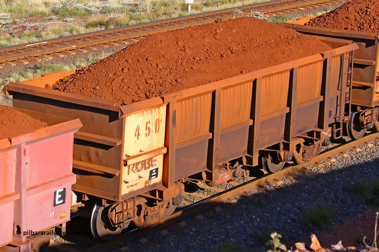 0450 210322 9720
Robe River ore waggon 450, built by Tomlinson Steel WA, rotary coupler end non-handbrake side loaded view at the 17 km on the Cape Lambert line, March 22, 2021.
Keywords: 450;Tomlinson-Steel-WA;Robe-ore-waggon;