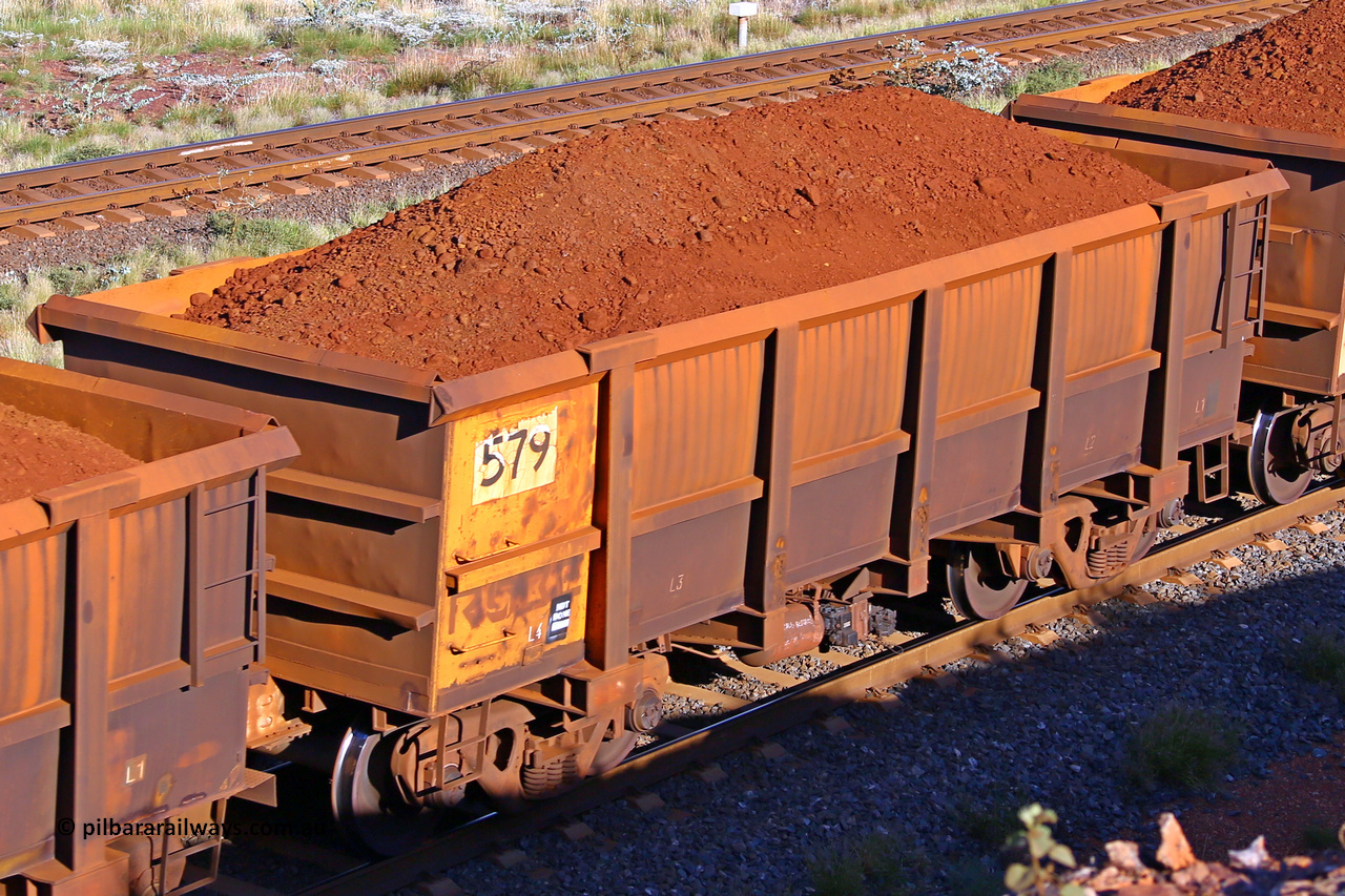 0579 210322 9757
Robe River ore waggon 579, built by Tomlinson Steel WA, rotary coupler end non-handbrake side loaded view at the 17 km on the Cape Lambert line, March 22, 2021.
Keywords: 579;Tomlinson-Steel-WA;Robe-ore-waggon;
