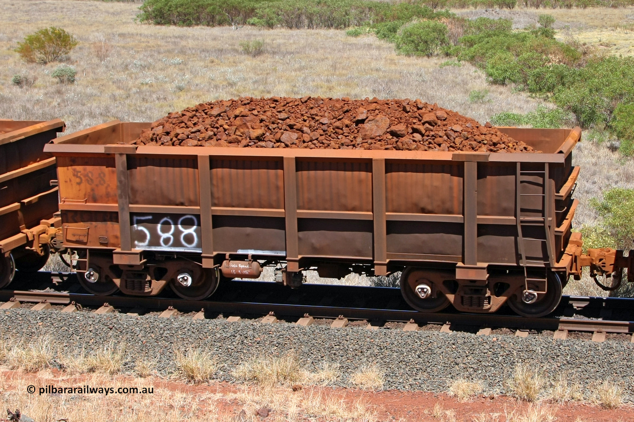 0588 081209 0152
Robe River ore waggon 588, built by Tomlinson Steel WA, fixed coupler non-handbrake side loaded view at the 7 km location just south of Cape Lambert yard. December 9, 2008.
Keywords: 588;Tomlinson-Steel-WA;Robe-ore-waggon;