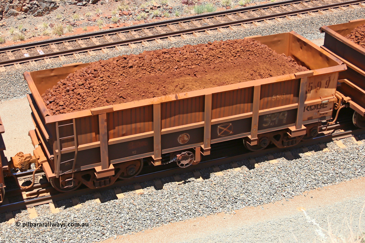 0599 160306 1492
Robe River ore waggon 599, built by Tomlinson Steel WA, fixed coupler handbrake side loaded view, at the 45 km, Harding Siding on the Cape Lambert line. March 6, 2016.
Keywords: 599;Tomlinson-Steel-WA;Robe-ore-waggon;