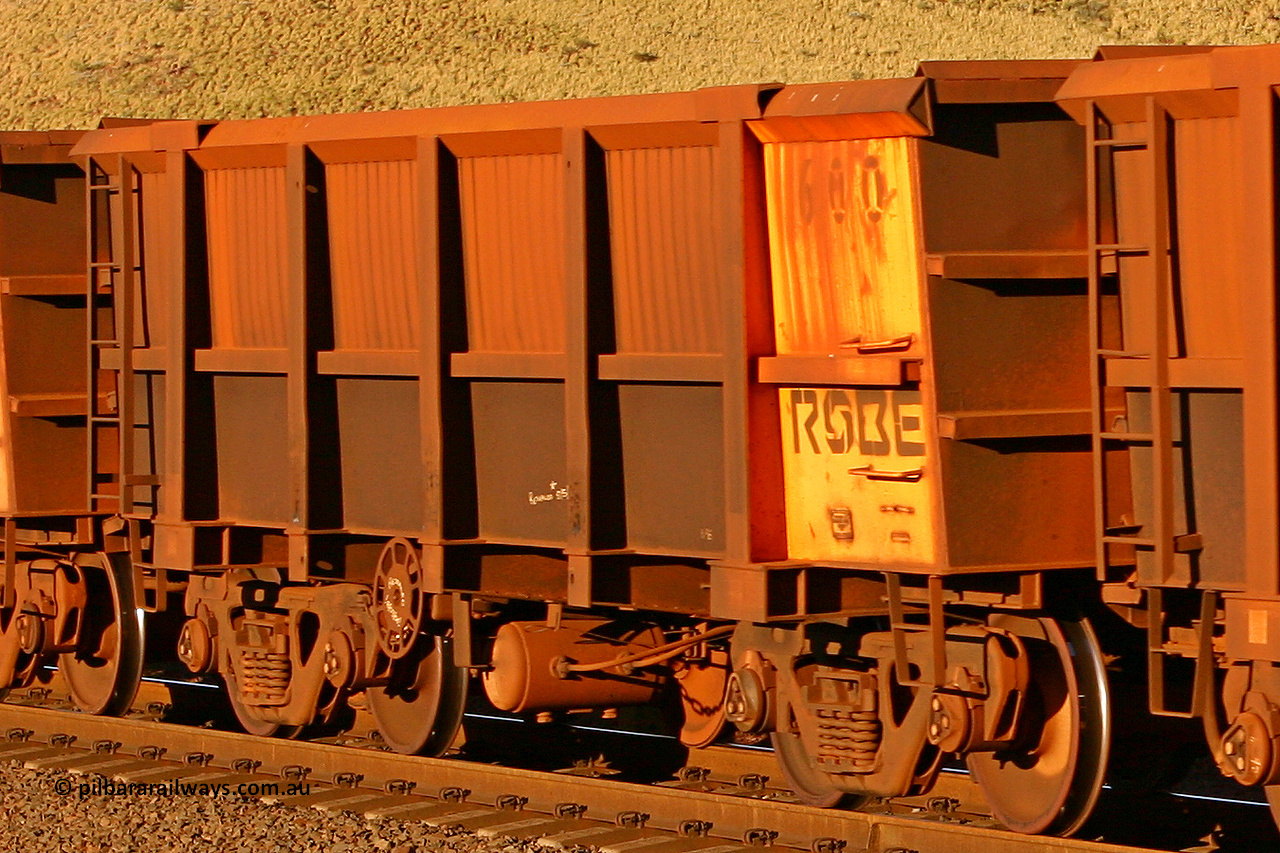 0600 060722 7591
Robe River ore waggon 600, built by Tomlinson Steel WA, rotary coupler end handbrake side empty view, at the 11.7 km, Cape Lambert. July 22, 2006.
Keywords: 600;Tomlinson-Steel-WA;Robe-ore-waggon;