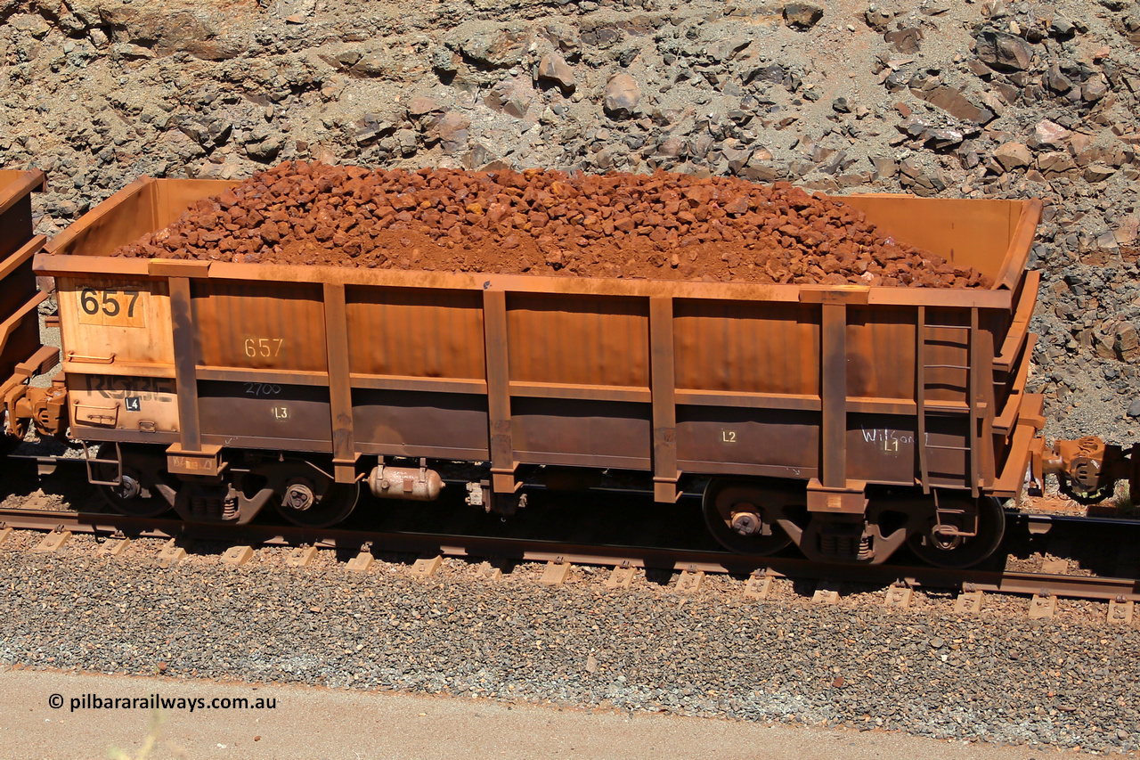 0657 160306 1657
Robe River ore waggon 657, built by Tomlinson Steel WA, fixed coupler non-handbrake side loaded view, at the 45 km, Harding Siding on the Cape Lambert line. March 6, 2016.
Keywords: 657;Tomlinson-Steel-WA;Robe-ore-waggon;
