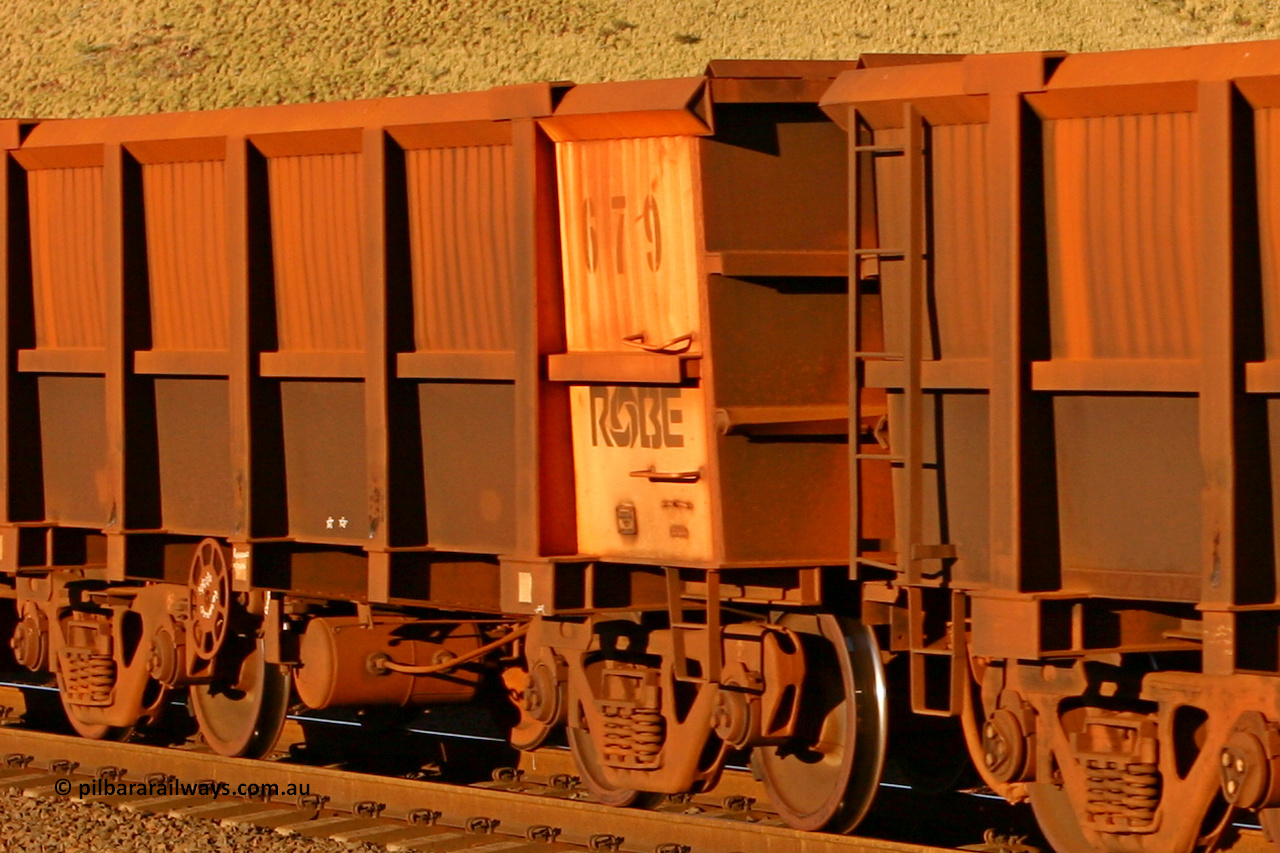0679 060722 7592
Robe River ore waggon 679, built by Tomlinson Steel WA, rotary coupler end handbrake side empty partial view, at the 11.7 km, Cape Lambert. July 22, 2006.
Keywords: 679;Tomlinson-Steel-WA;Robe-ore-waggon;