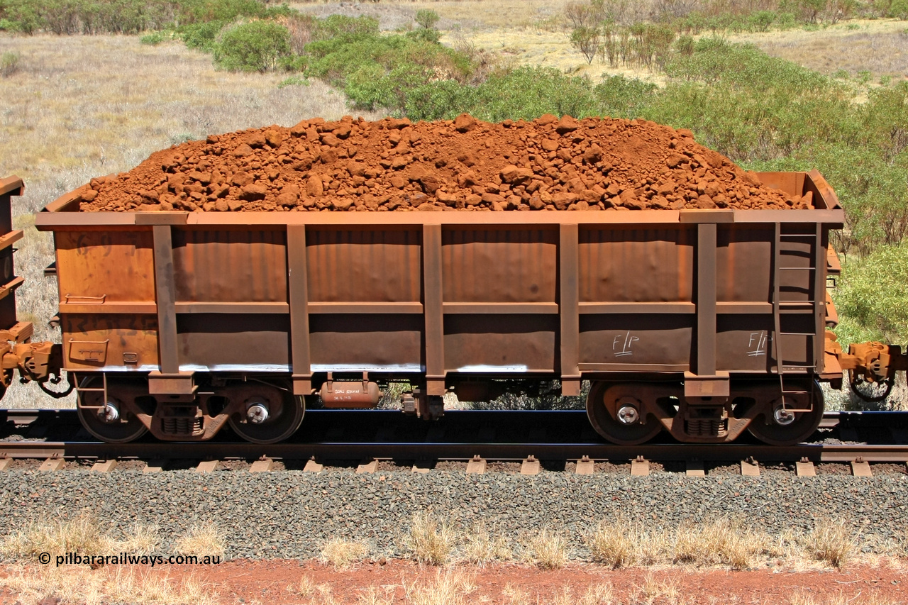 0697 081209 0144
Robe River ore waggon 697, built by Tomlinson Steel WA, fixed coupler non-handbrake side loaded view at the 7 km location just south of Cape Lambert yard. December 9, 2008.
Keywords: 697;Tomlinson-Steel-WA;Robe-ore-waggon;