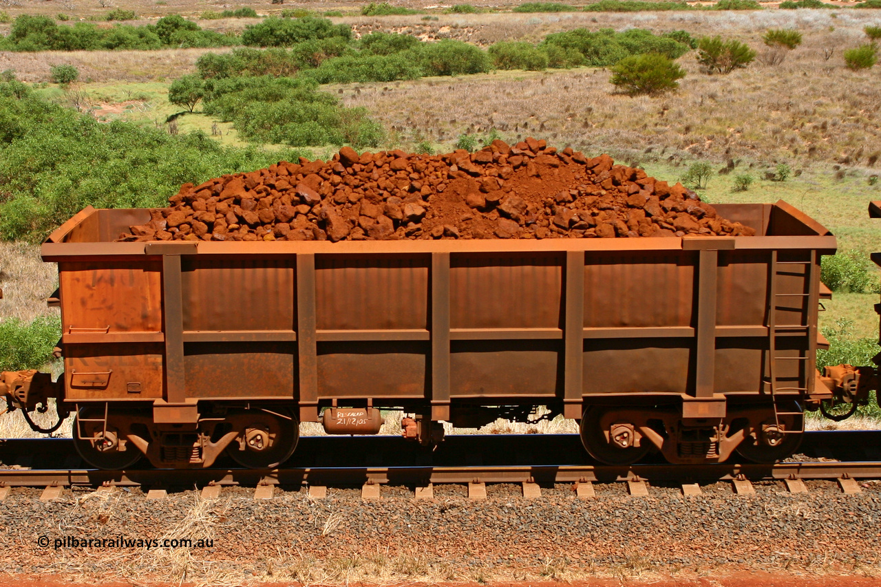 0711 061209 8190
Robe River ore waggon 711, built by Tomlinson Steel WA, fixed coupler non-handbrake side loaded view at the 7 km location just south of Cape Lambert yard. December 9, 2006.
Keywords: 711;Tomlinson-Steel-WA;Robe-ore-waggon;